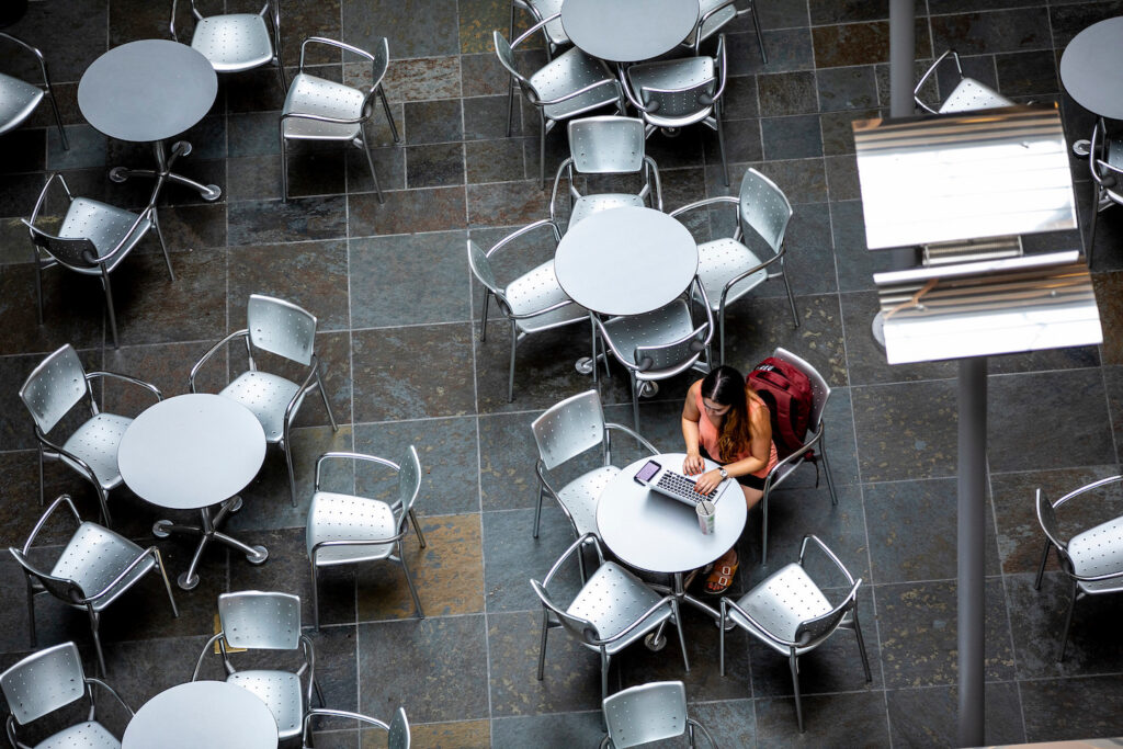 Students sitting at table on the University of Washington campus.