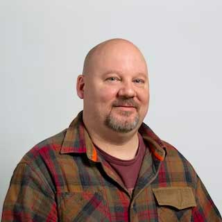 A professional headshot of online UW MSIM faculty member, Greg Hay
