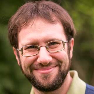 A professional headshot of online UW MSIM faculty member, Joel Ross