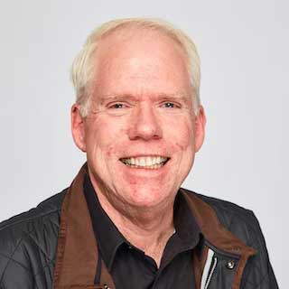A professional headshot of online UW MSIM faculty member, Mike Doane